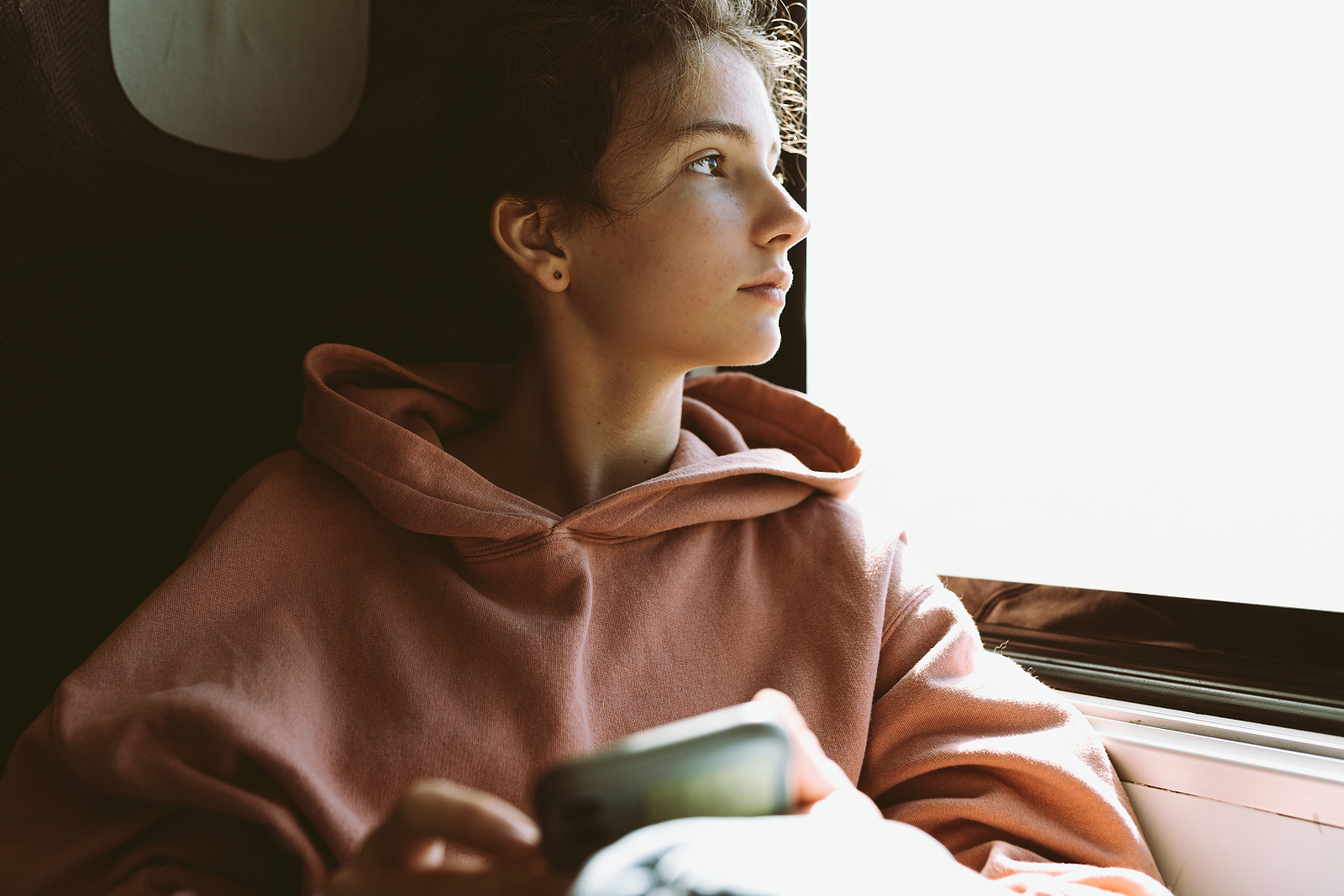 A woman wondering "Can I Get Abortion Pills Over the Counter?"